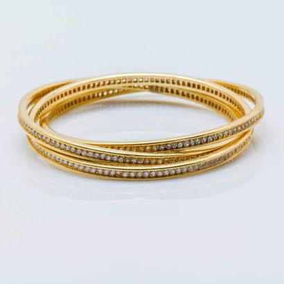 CARTIER Bracelet «Trinity» en or jaune 18 carats (750 millièmes) formé de trois anneaux...