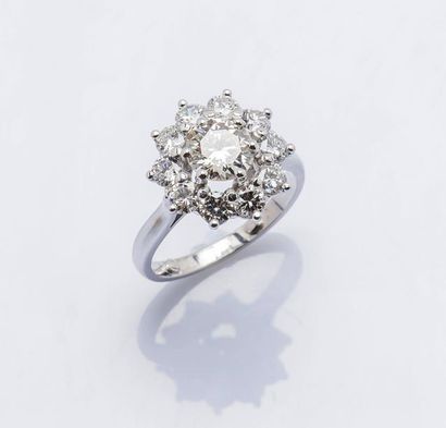 null Bague fleur en or gris 18 carats (750 millièmes) sertie d’un diamant taillé...
