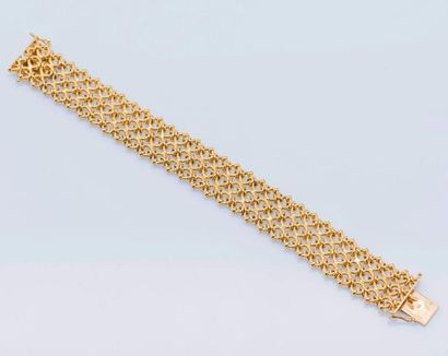 null Bracelet ruban ajouré en or jaune 18 carats (750 millièmes) formant trois rangs...