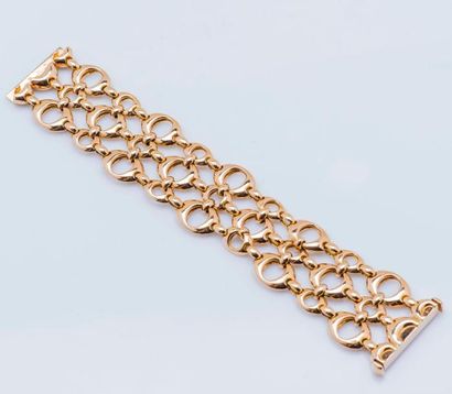 DIOR Large bracelet ruban ajouré en or jaune 18 carats (750 millièmes) à trois rangs...