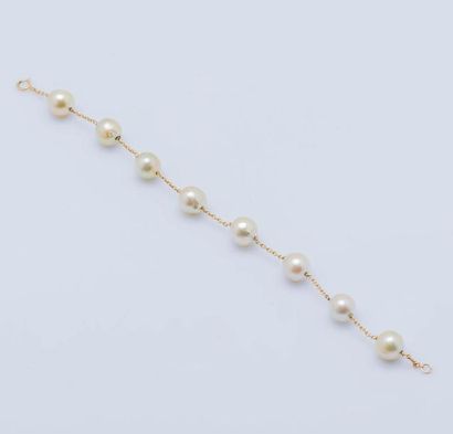 null Bracelet chaînette en or jaune 14 carats (585 millièmes) serti de perles de...