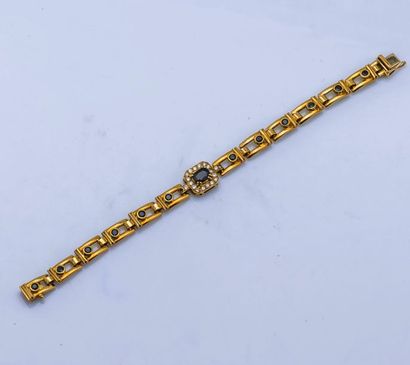 null Bracelet articulé en or jaune 18 carats (750 millièmes) les maillons rectangulaires...