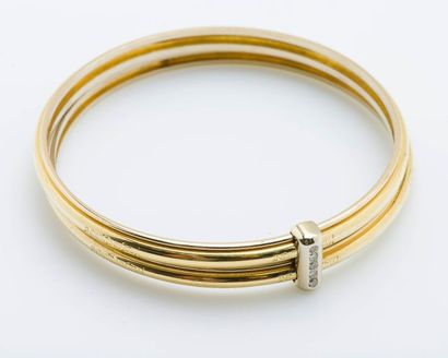 Yves Saint LAURENT Paire de bracelets jonc en or jaune 18 carats (750 millièmes)...