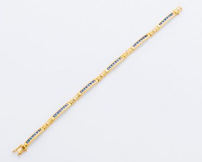 null Bracelet en or jaune 18 carats (750 millièmes) composé de barrettes articulées...