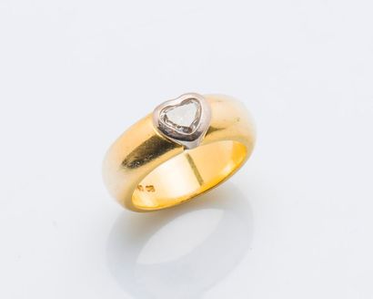 null Bague jonc en or jaune et or gris 18 carats (750 millièmes) ornée d’un diamant...