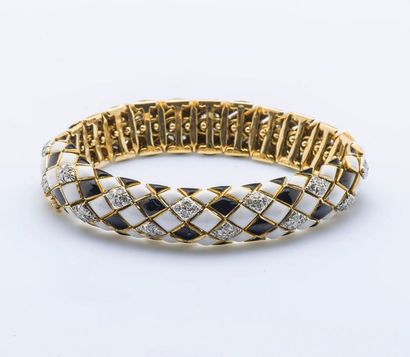 DAVID WEBB Bracelet souple articulé en or jaune 18 carats (750 millièmes) et platine...