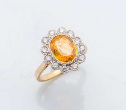 null Bague fleur en or jaune et or gris 18 carats (750 millièmes) sertie d’un saphir...