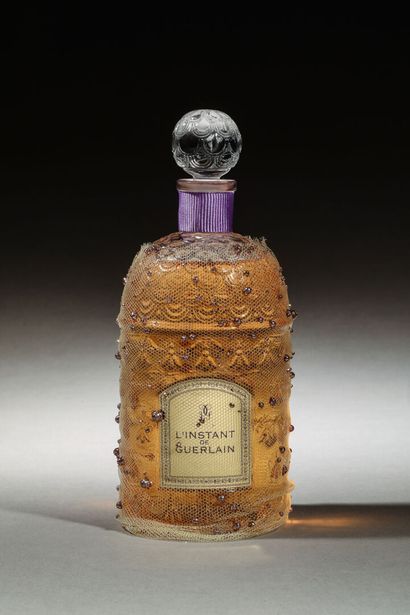 null Guerlain - "L'Instant" (2003) 
Bottle model "Abeilles Blanches" dressed with...