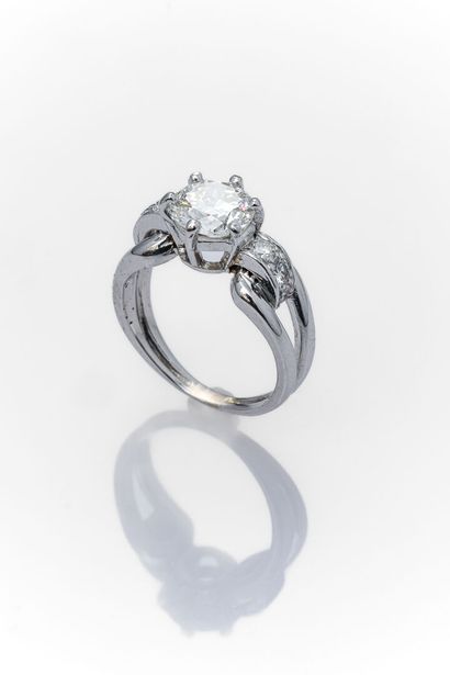 Solitaire ring in platinum set with a modern...