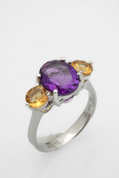 White gold ring set with an oval amethyst...
