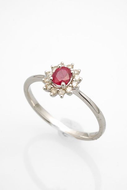null White gold daisy ring set with a ruby (chips) in a diamond setting.
Weight:...