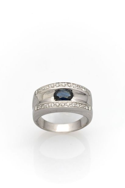 null White gold ring set with an oval-cut sapphire and two lines of diamonds.
Weight:...