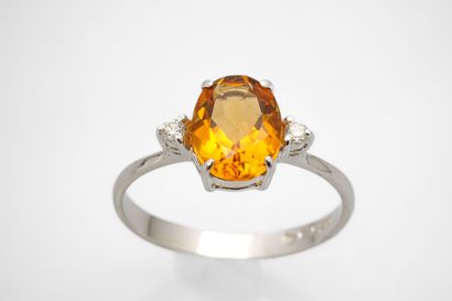 White gold ring adorned with a citrine weighing...