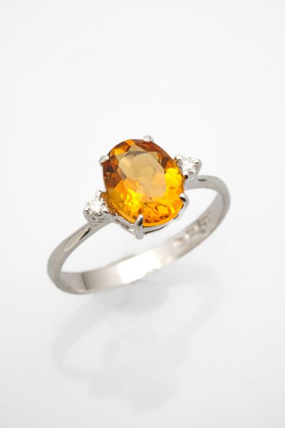 null White gold ring adorned with a citrine weighing approximately 1.5 carats and...
