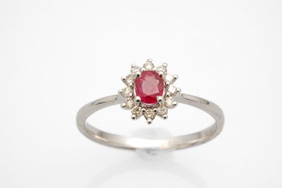 null White gold daisy ring set with a ruby (chips) in a diamond setting.
Weight:...