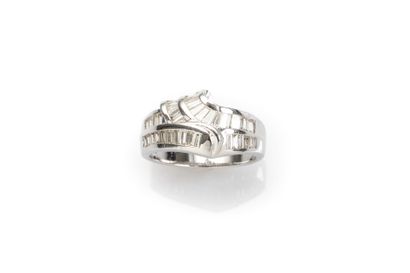 null Modern ring in 18K white gold set with lines of baguette-cut diamonds.
Weight:...