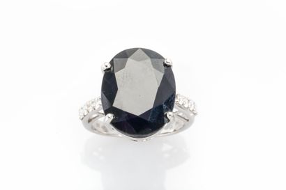 18K white gold ring set with a large Sapphire...