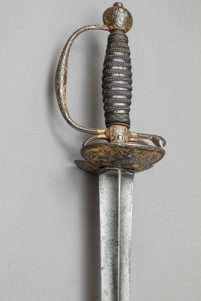 null Court sword, gold-ground chased iron hilt decorated with flowers and foliage,...