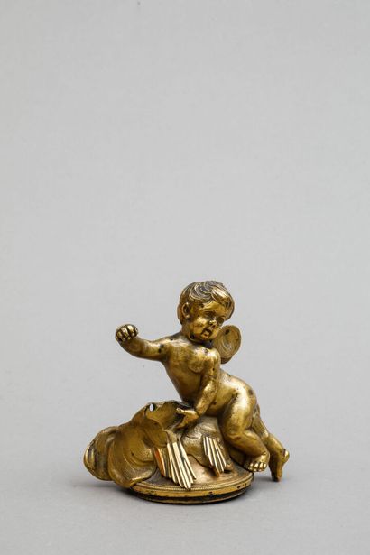 null Gilded bronze trim featuring a cherub.
Height: 10.5 cm