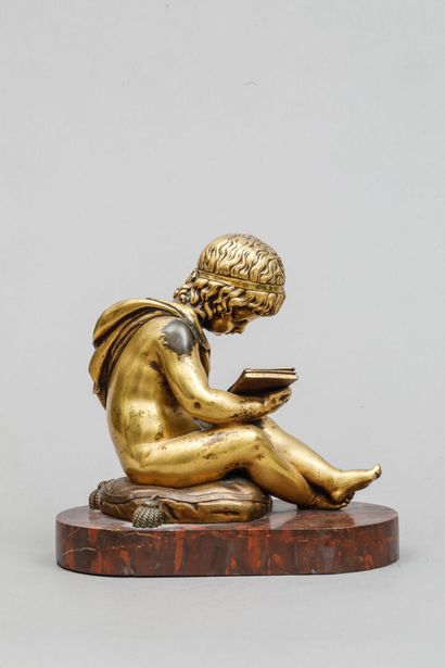 null Gilded bronze bookend featuring a cherub reading.
19 x 20 cm