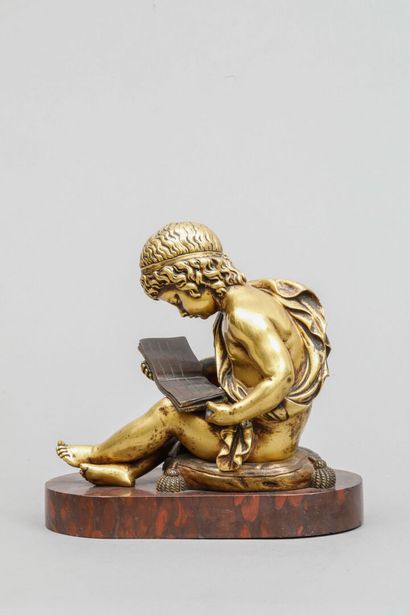null Gilded bronze bookend featuring a cherub reading.
19 x 20 cm
