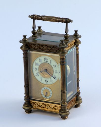 null A bronze and gilt brass officer's clock, the bevelled glass sides framed by...