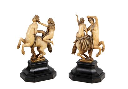 null Two carved ivory groups representing a couple of centaurs ridden by amazons....