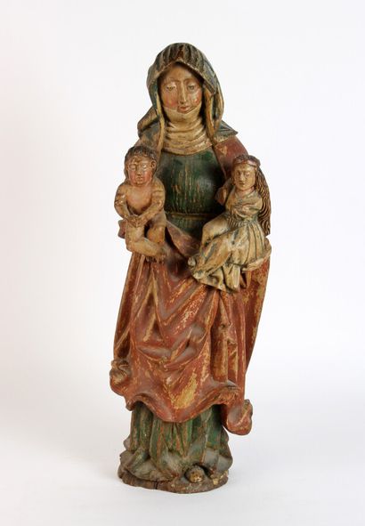 null GROUPE en bois sculpté polychromé représentant Sainte Anne trinitaire portant...