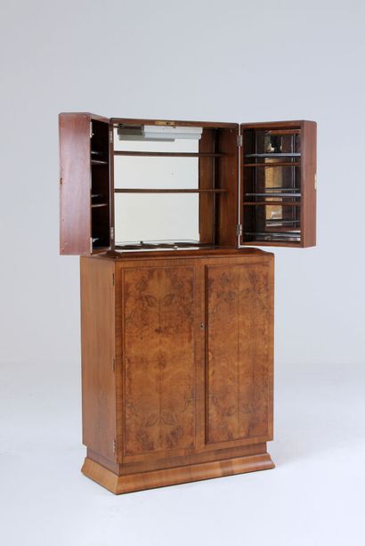 null TWO BODY CABINET FORMING A BAR in walnut and burr veneer, the upper part opening...