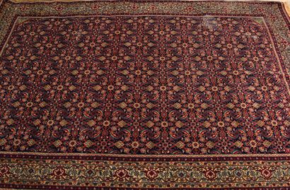 Persian carpet with stylized floral decoration...