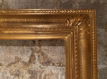Wooden frame and gilded stucco with flutes...