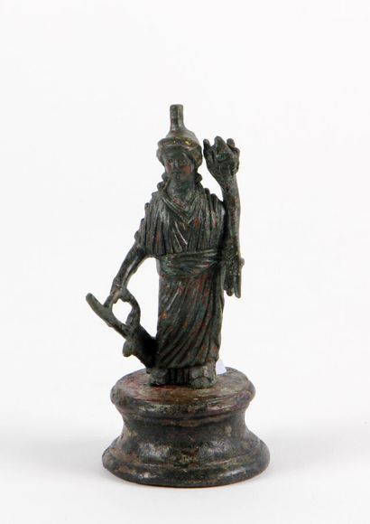 null ISIS FORTUNA represented standing on a cylindrical base, wearing a long chiton....