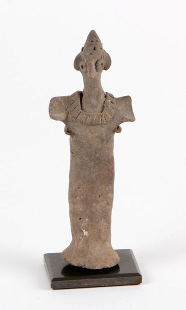 null IDOL with bird's beak adorned with a large necklace.
Terracotta
Syro-Hittite...