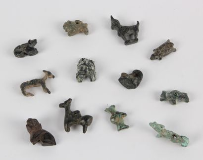 null Lot of twelve ZOOMORPHES AMULETS: ibex, bovid, turtle, dog, frog, duck.
Bronze...