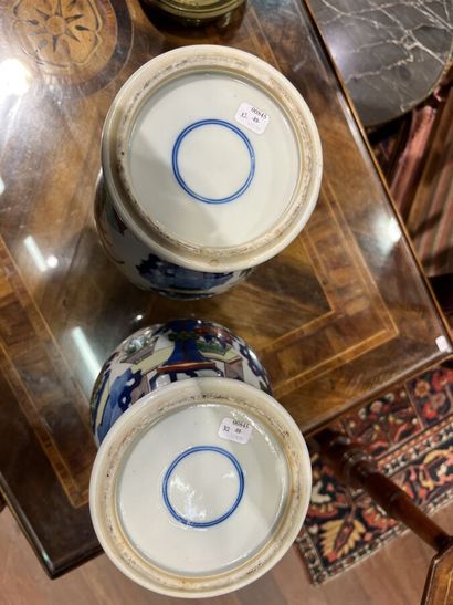 null Pair of porcelain and wucai enamel baluster VASES with small ringed necks decorated...