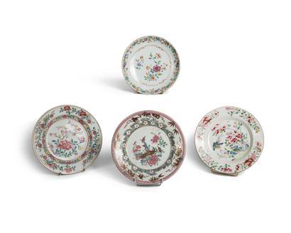 null Four porcelain and enamel plates of the pink family decorated with flowers,...