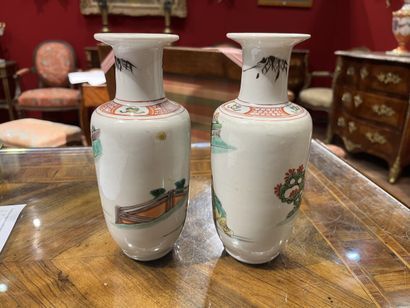 null Pair of small porcelain spindle-shaped VASES and enamels of the green family...