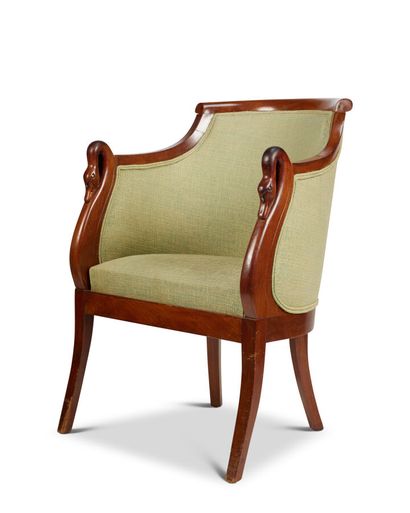 null A mahogany and mahogany veneer desk chair with a gondola back, swan neck armrests...