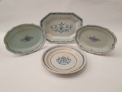 null Four earthenware PLATES with white-blue decoration of flowered basket or foliage,...