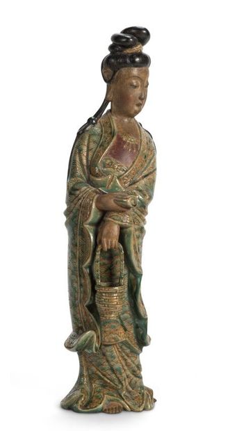 null Polychrome patinated and glazed ceramic STATUTE representing a young girl standing...