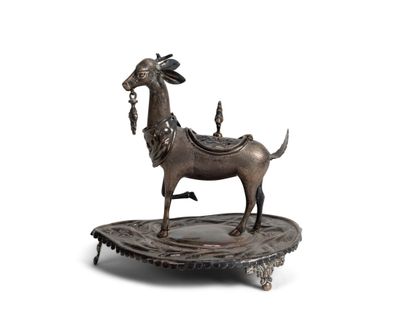 null Silver candle-burner in the shape of a stag, standing on a cordial base.

Foreign...