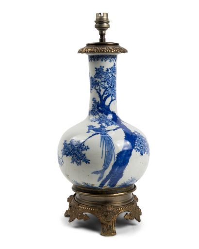 null LAMP STAND consisting of a baluster vase with a high neck in white porcelain...