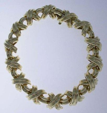 TIFFANY Bracelet articulé rubans croisés en or 18K - Long: 18,5 cm - Poids: 45 g...