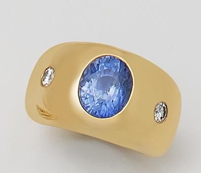 null Bague jonc en or jaune 18K (750 °/°°) sertie d'un saphir taille brillant épaulé...