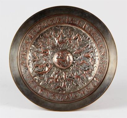 null F. BARBEDIENNE
COUPE ronde sur piédouche en bronze, le plateau à décor en bas-relief...