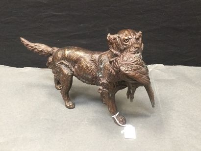 null Two sculptures in cast iron with a golden brown patina, "Dog with a hare" "Dog...