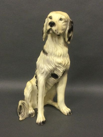 Large resin subject representing a dog sitting,...