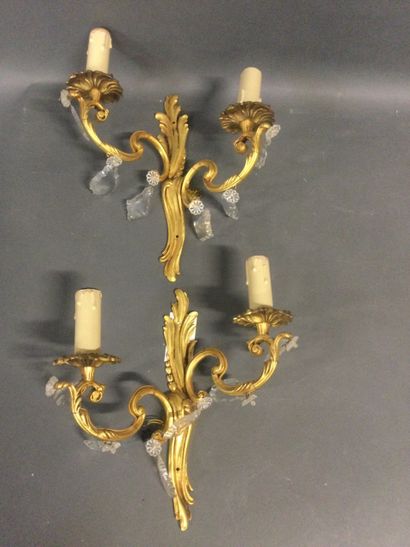 A pair of gilt bronze sconces with two light...