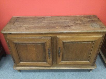 null LOW CABINET in molded and carved oak, opening by two doors in front and 4 drawers...