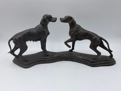 SCULPTURE in cast iron showing two dogs facing...